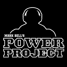 Logo of Power Project featuring a shadowy silhouette of a muscular man wearing headphones above the brand name, symbolizing strength, fitness, and podcast or audio training content.