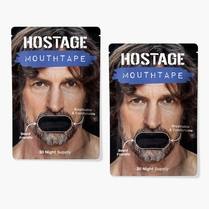 Two black Hostage Mouth Tape pouches to improve sleep, stop mouth breathing, and reduce snoring