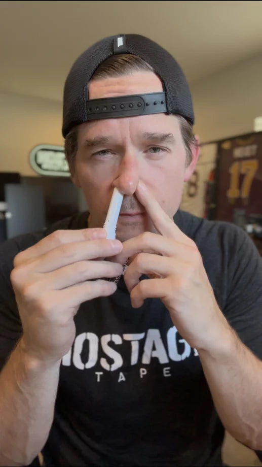 Holding the Hostage Nasal Stick near one nostril