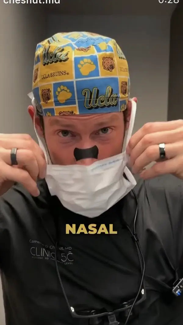 Man wearing a Hostage Nose Strip at work